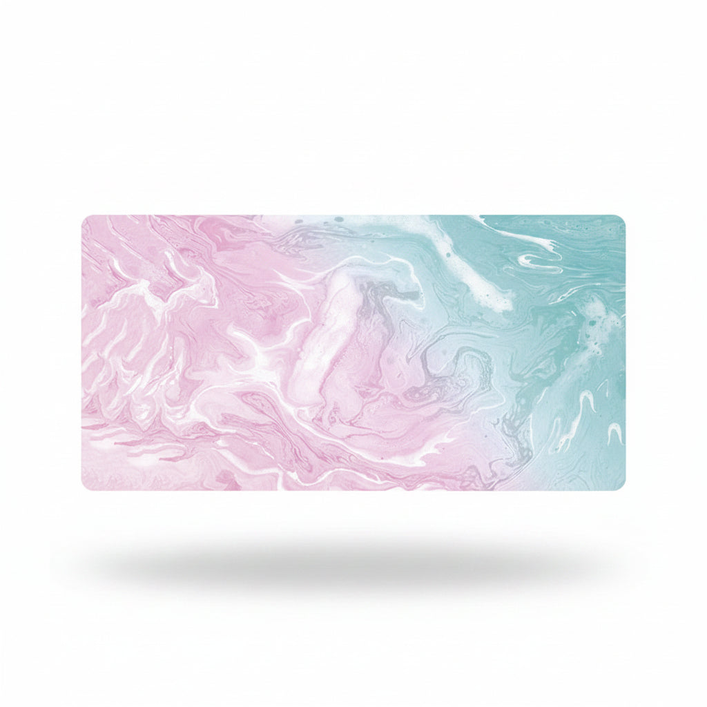 A rectangular desk mat with a pastel pink and mint green marbled swirl pattern, shown floating on a white background with a soft drop shadow.