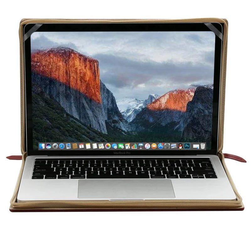 Laptop with a mountainous landscape on the screen, enclosed in a brown leather case.