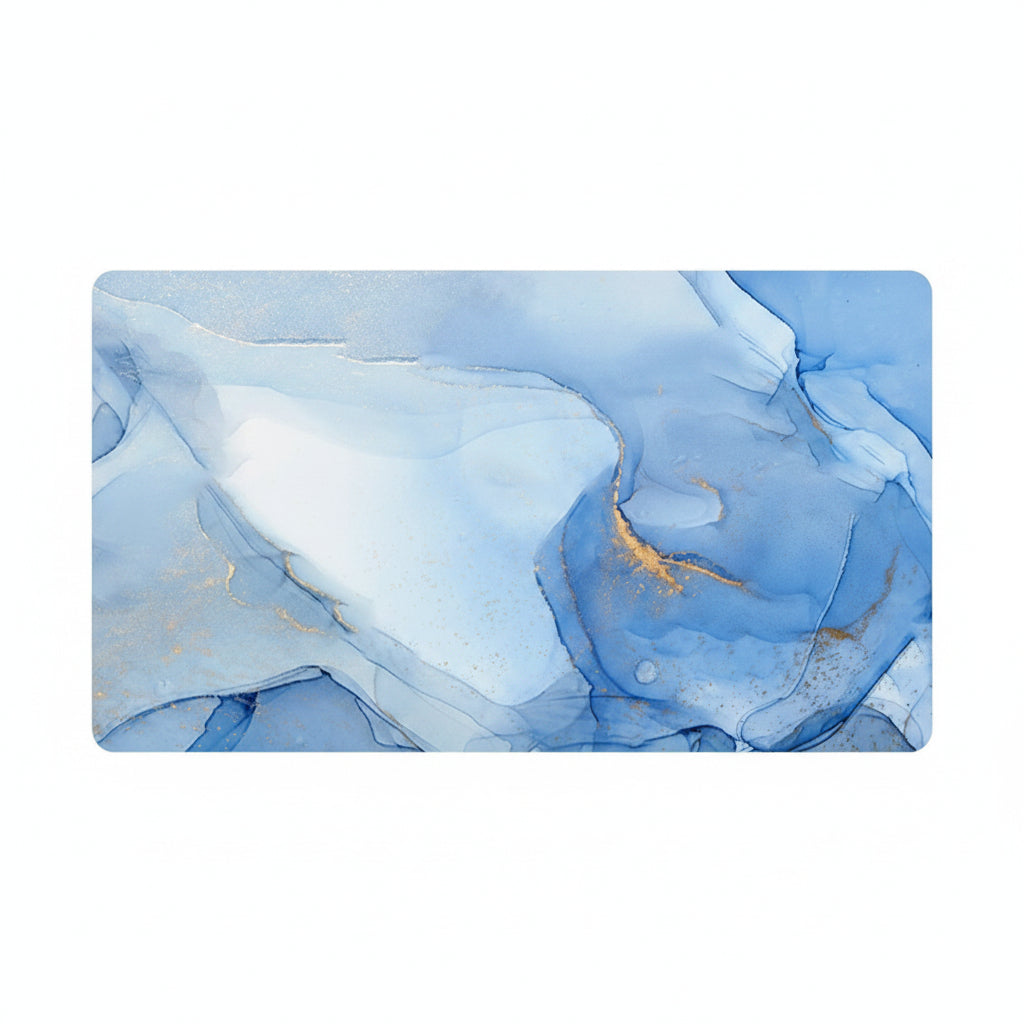 A rectangular desk mat featuring an abstract blue and white fluid art design with subtle gold veining, shown on a plain white background.
