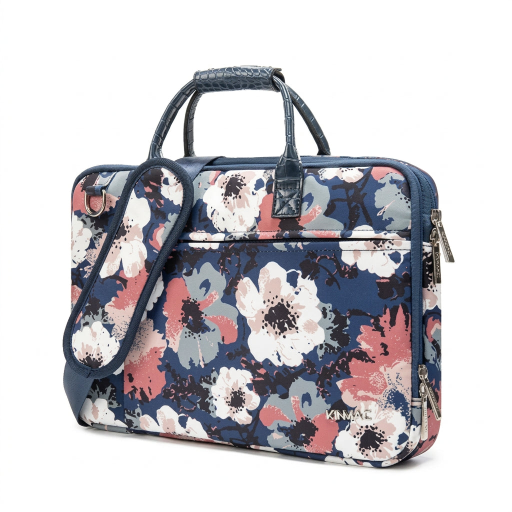 Camellia floral Kinmac laptop messenger bag featuring a multicoloured floral print, top handles and shoulder strap.