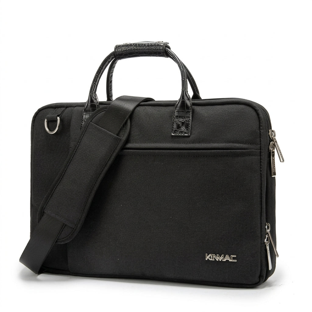 Black Kinmac padded laptop messenger bag with top handles, shoulder strap and front zip pocket.