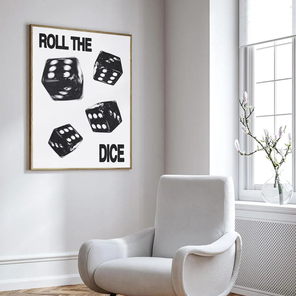 Framed poster with dice design on a wall above a white armchair.
