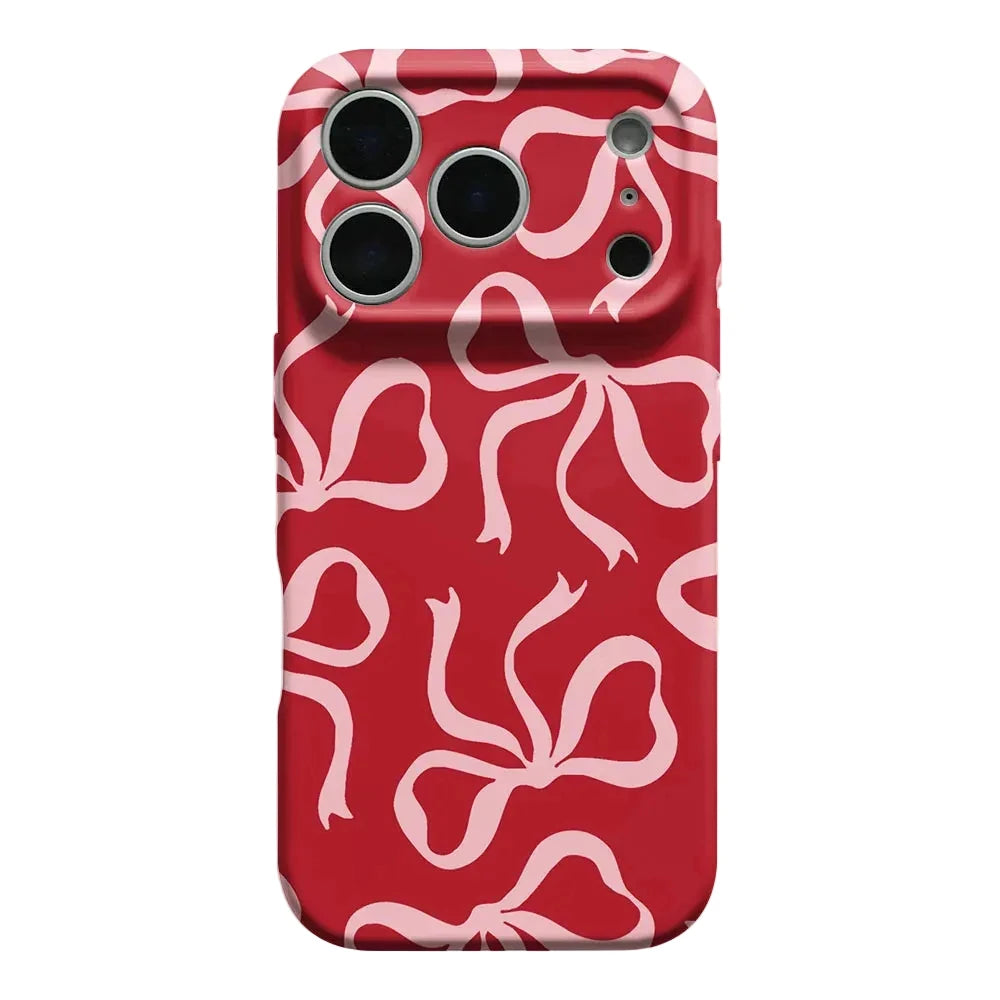 A red phone case with a repeating light pink abstract ribbon or bow pattern, shown from the back on a white background.