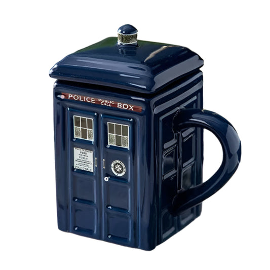Blue TARDIS mug with a lid on a surface with a blurred background