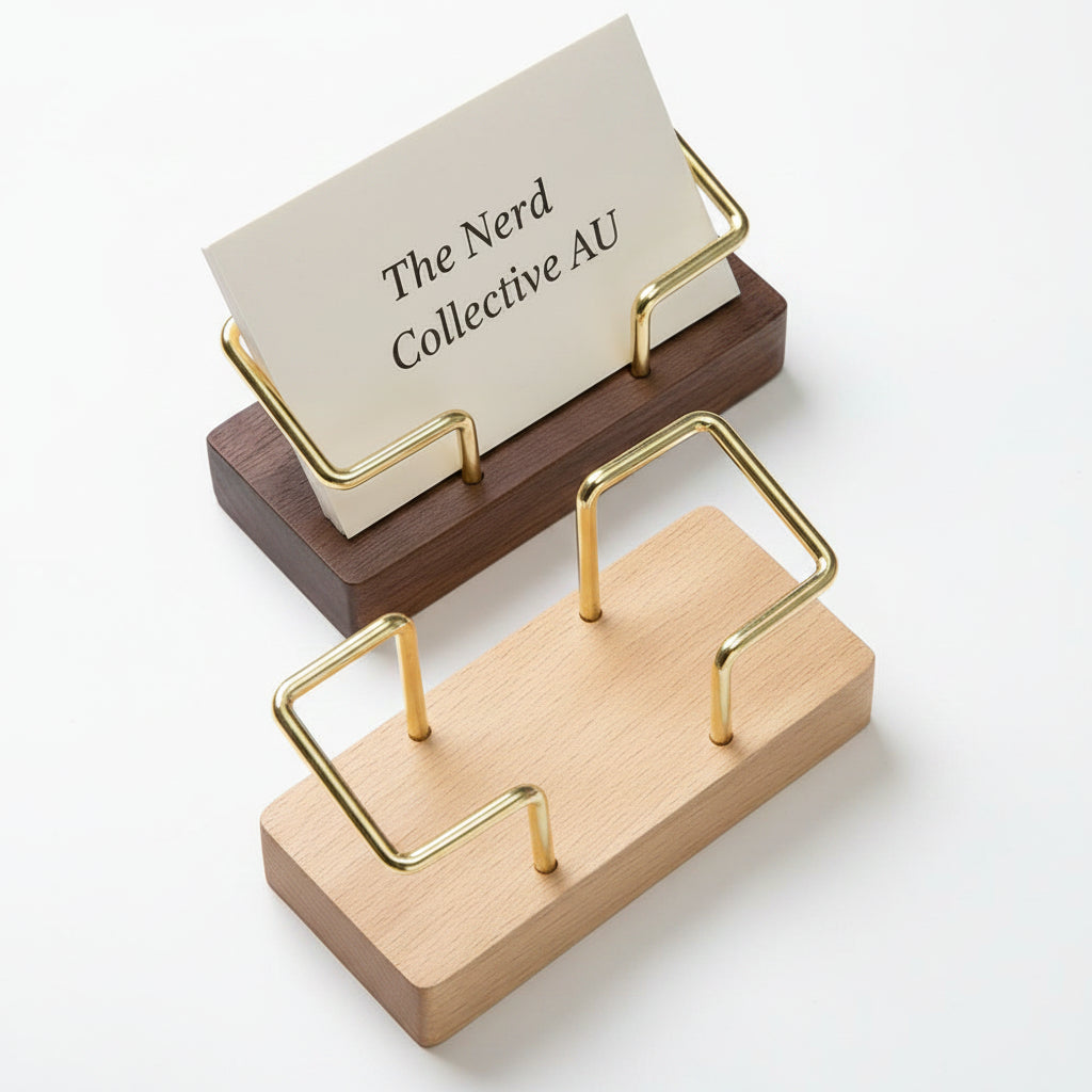 Wooden and gold business card holder with cards on a white surface