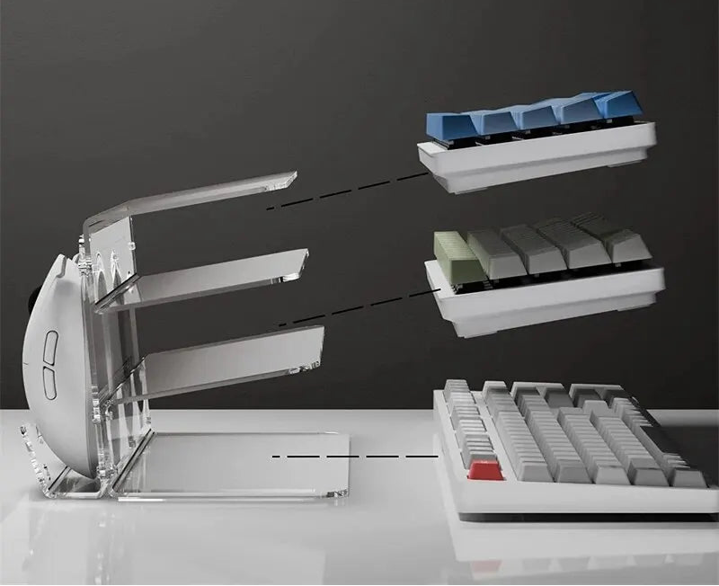 Keyboard with separate keycaps on a clear stand against a dark background