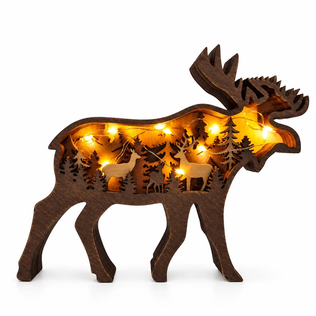 Wooden moose-shaped decorative light with cut-out designs on a gray background