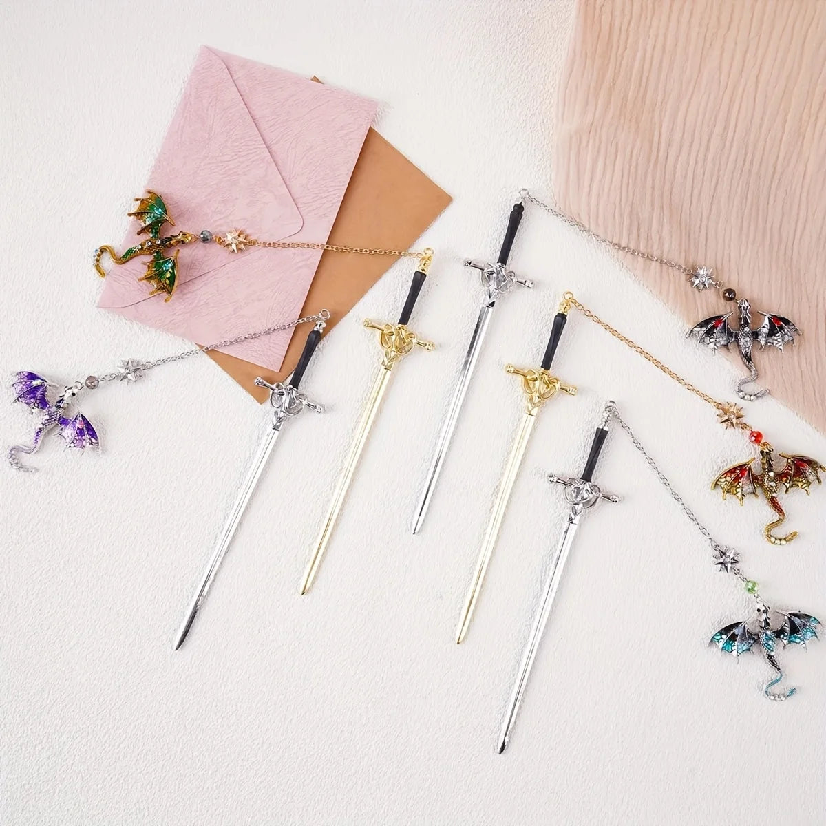 Decorative swords with dragon bookmark designs on a light background