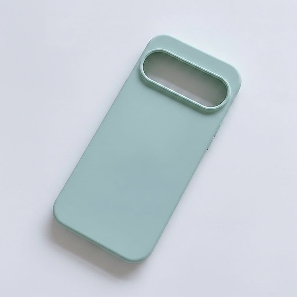 A matte mint green phone case with a large camera cutout, shown from a top-down angle on a clean white background.