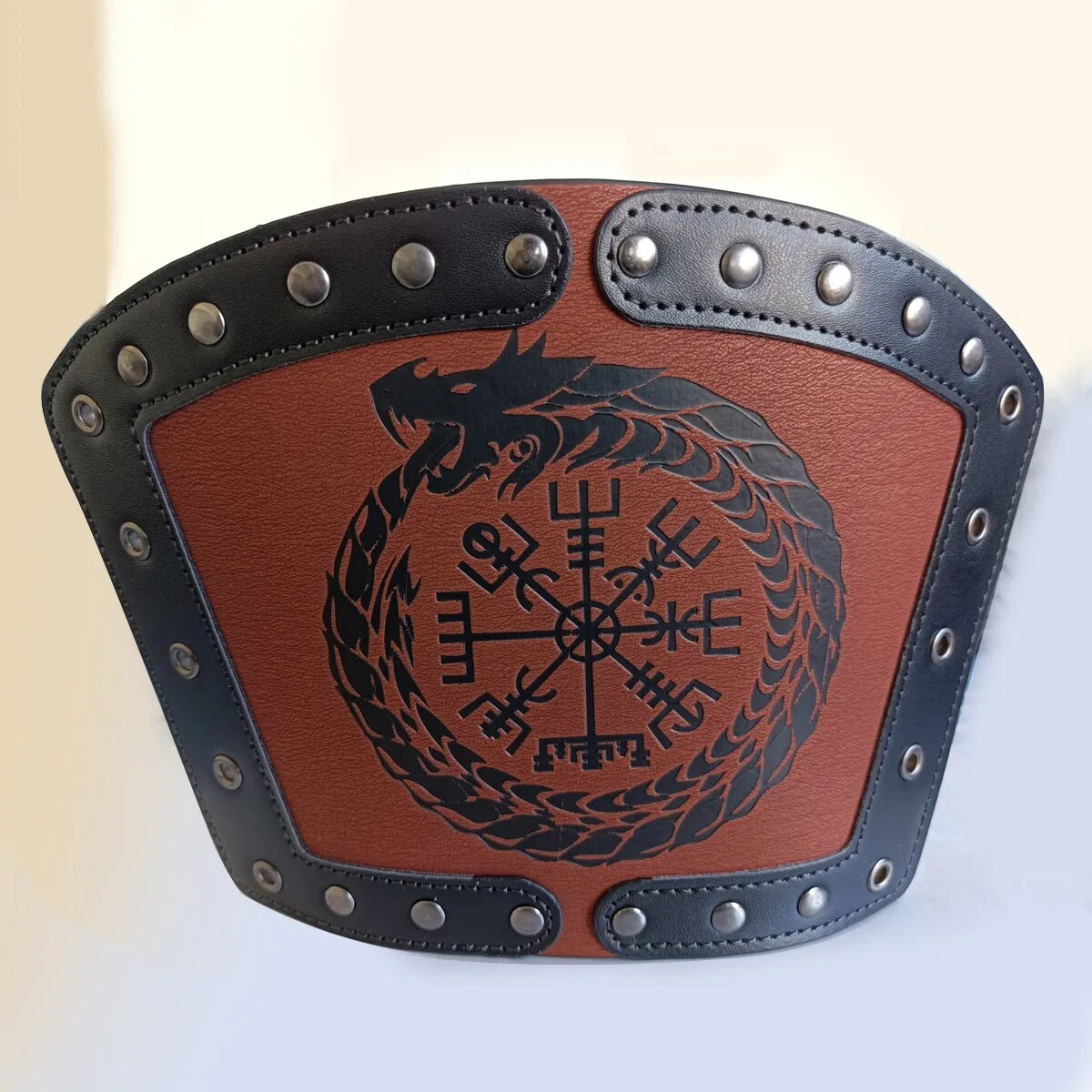 Front view of brown Viking forearm cuff with Norse compass-style symbol and black strap details