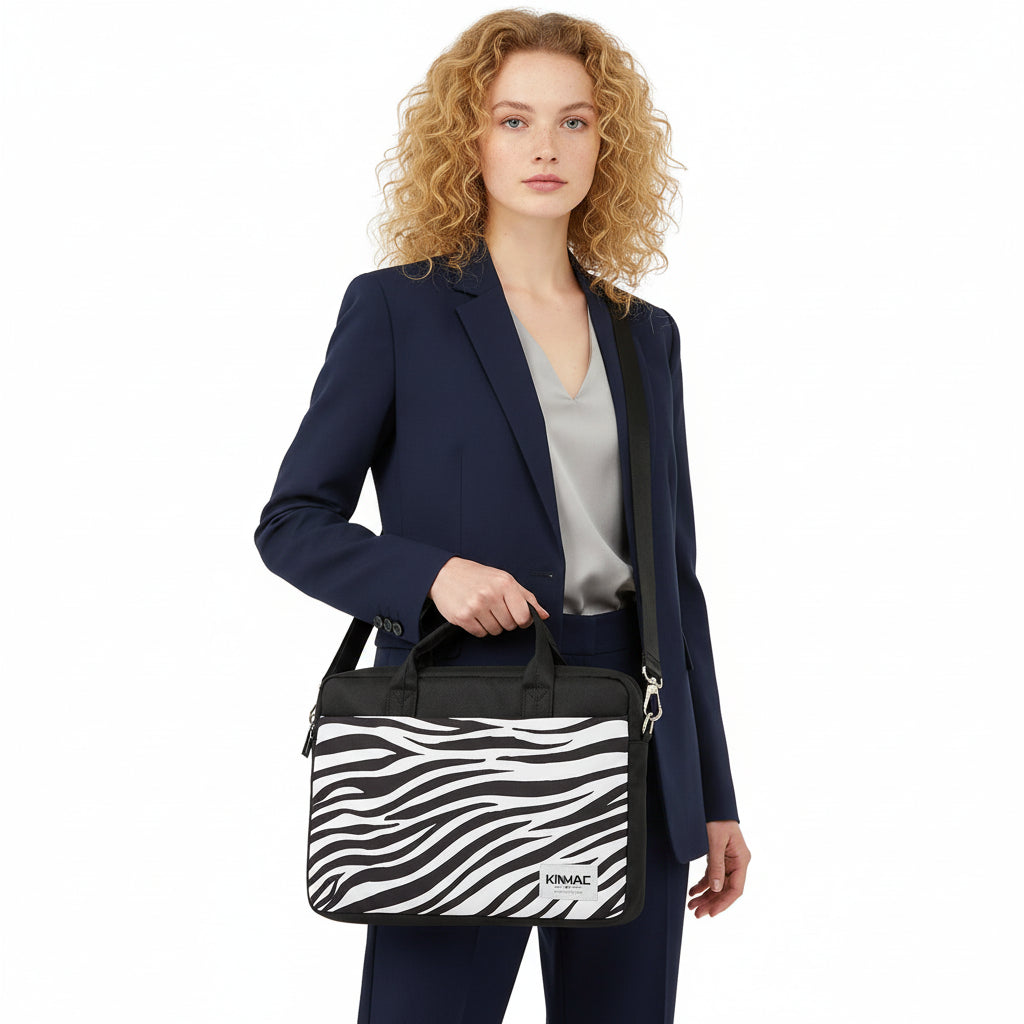 Woman carrying zebra Kinmac laptop messenger bag