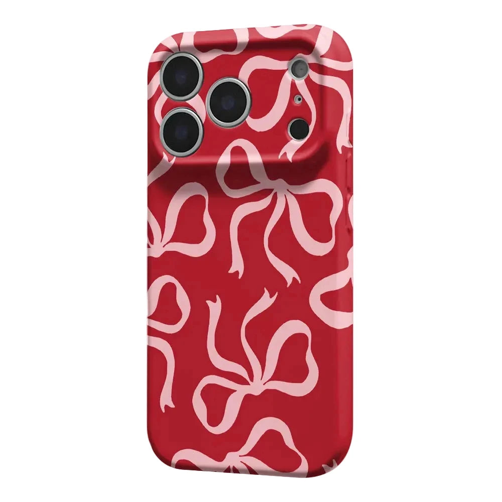 A red phone case with a repeating light pink abstract ribbon or bow pattern, shown on a white background.