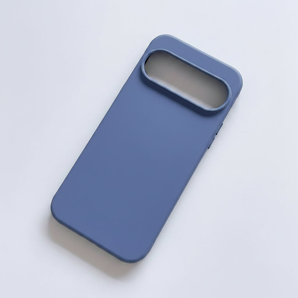 A matte slate blue phone case with a raised camera bumper, shown from an angled overhead view on a clean white background.