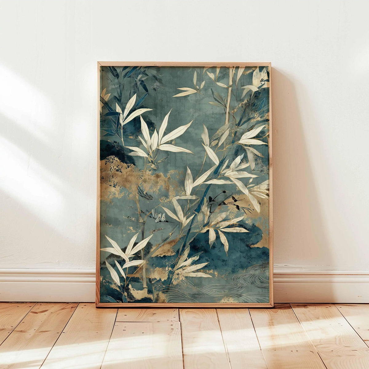 Framed artwork with leaf design on a white wall