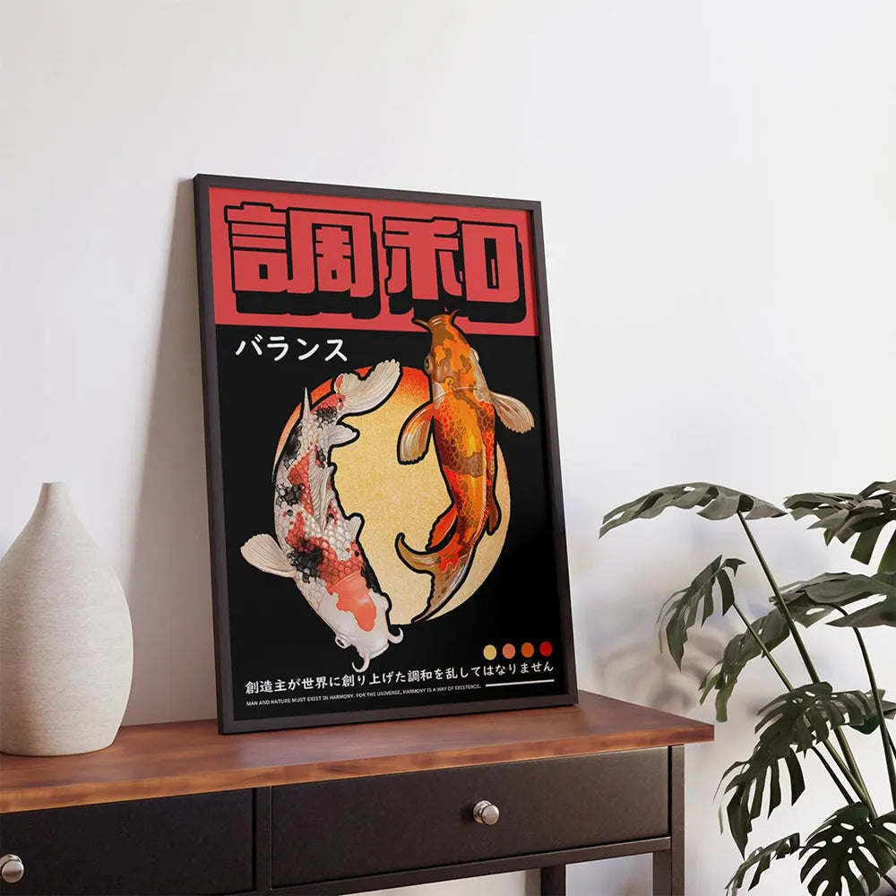 Framed artwork with Koi fish design on a wooden surface with a plant and vase in the background.