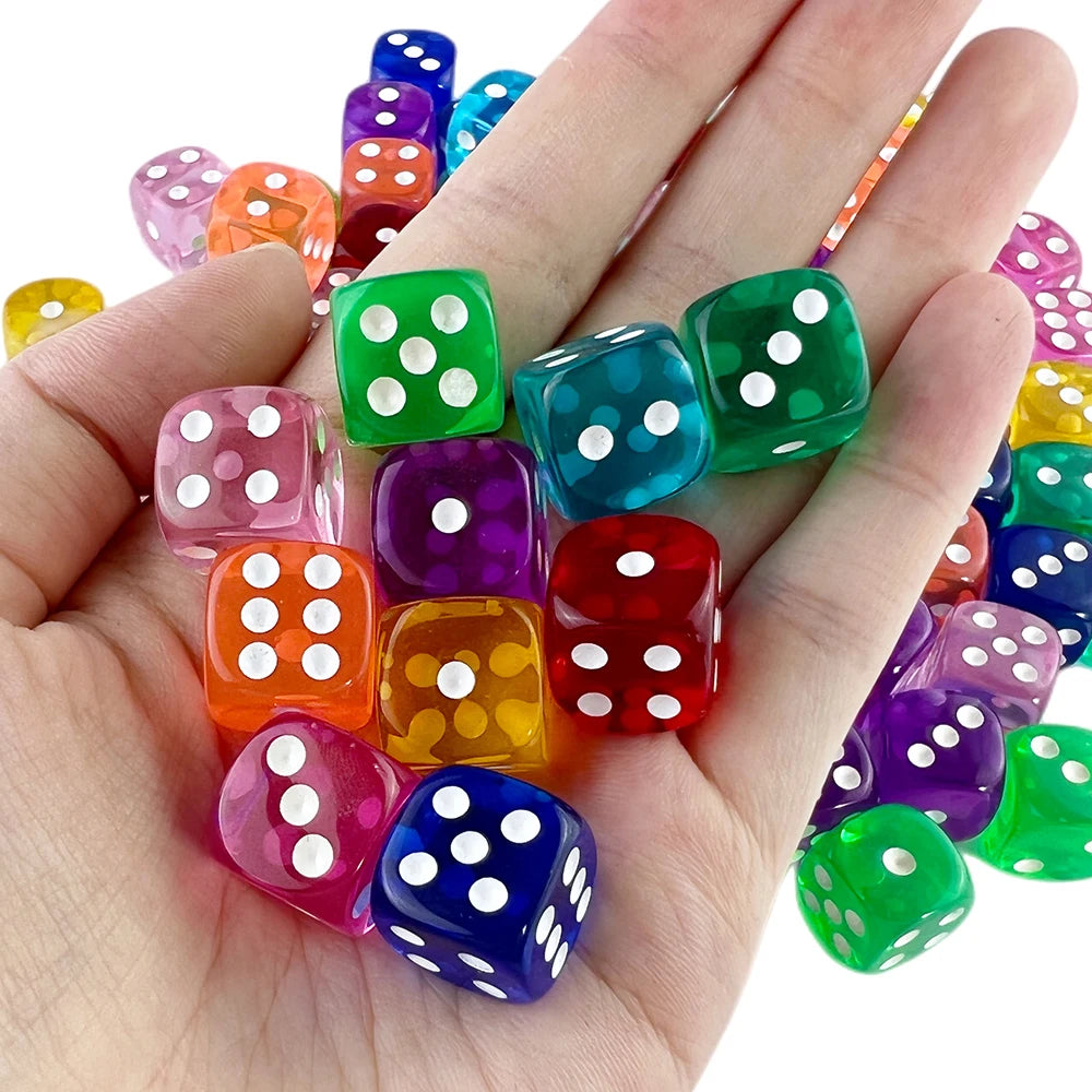 Colourful transparent six-sided dice shown in hand