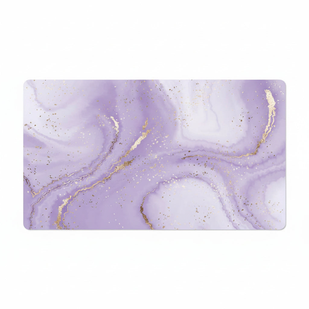 A rectangular desk mat featuring a lavender purple and white marble pattern with metallic gold veining and subtle gold glitter, shown against a plain white background.