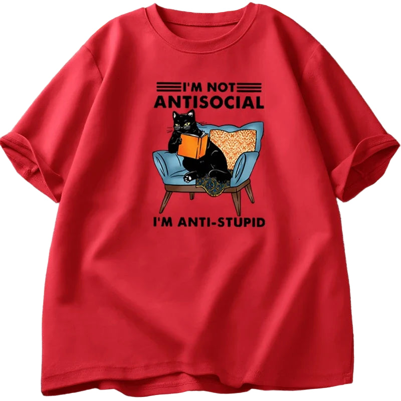 Red t-shirt with a black cat graphic and text on a textured surface