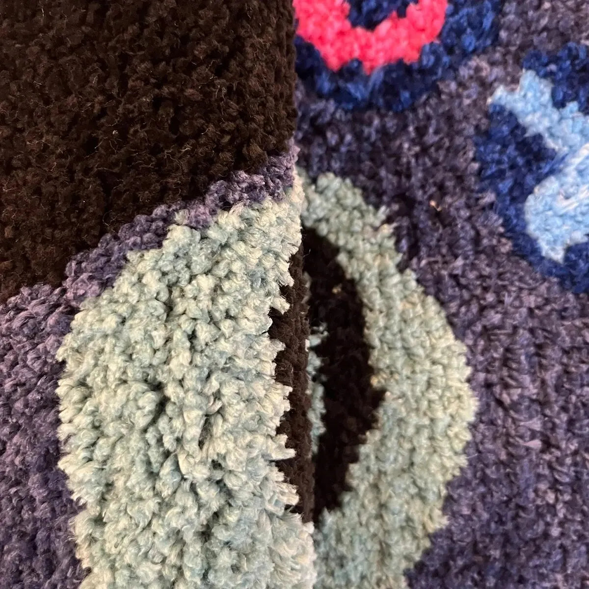 Close-up of hand tufted gamer controller rug
