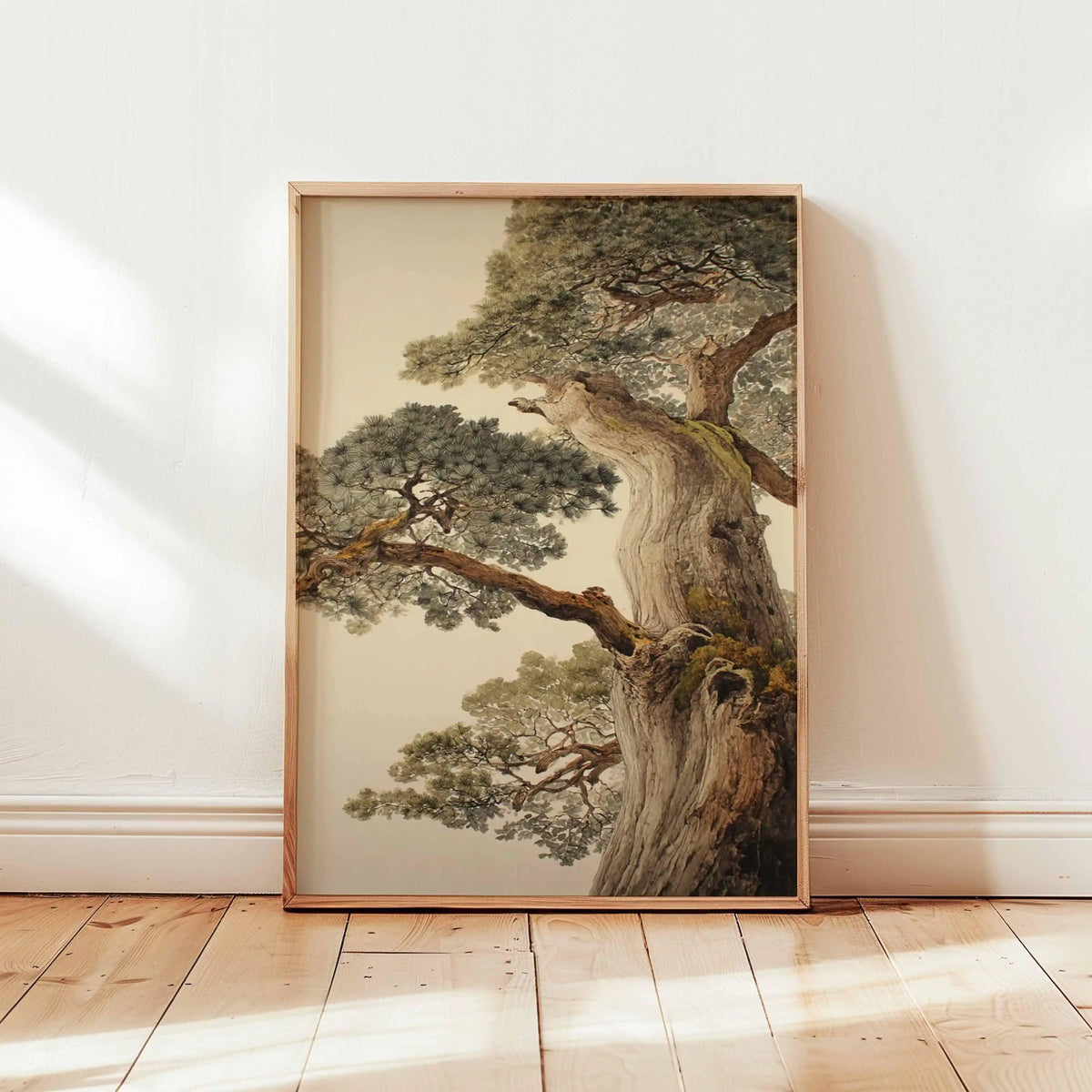 Framed artwork of a tree on a white wall with wooden floor