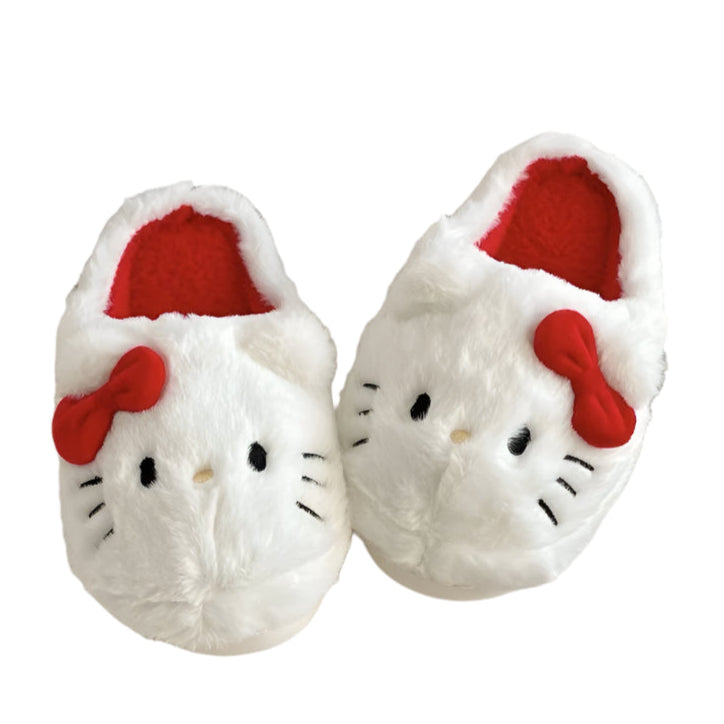 White slippers with red bows and black eyes on a white background