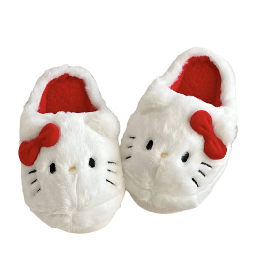 White slippers with red bows and black eyes on a white background