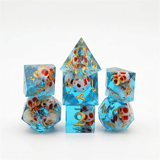Seven translucent blue resin polyhedral dice with embedded skull details and numbered faces