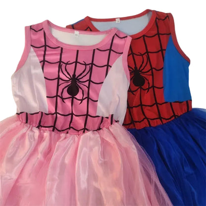 Two children's dresses with spider web design, one pink and one blue, on a white background.