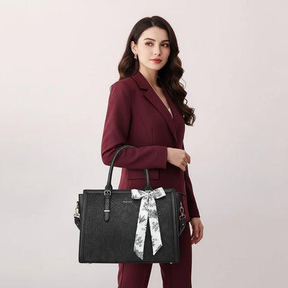 Woman carrying MOSISO floral laptop tote bag in black