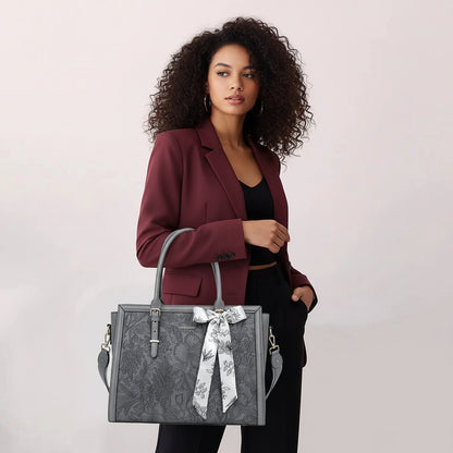 Woman carrying MOSISO floral laptop tote bag in grey