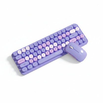 A wireless keyboard and matching mouse in pastel purple, lavender, and pink tones, arranged on white background