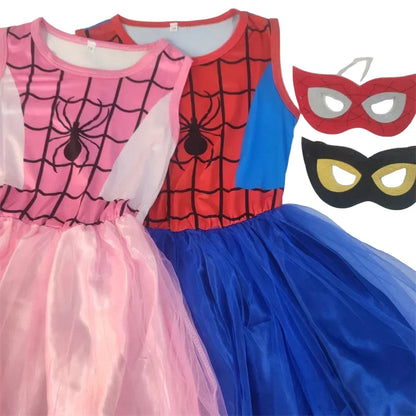Two superhero-themed children's dresses, one pink with a spider design and one blue with a mask design, on a white background.