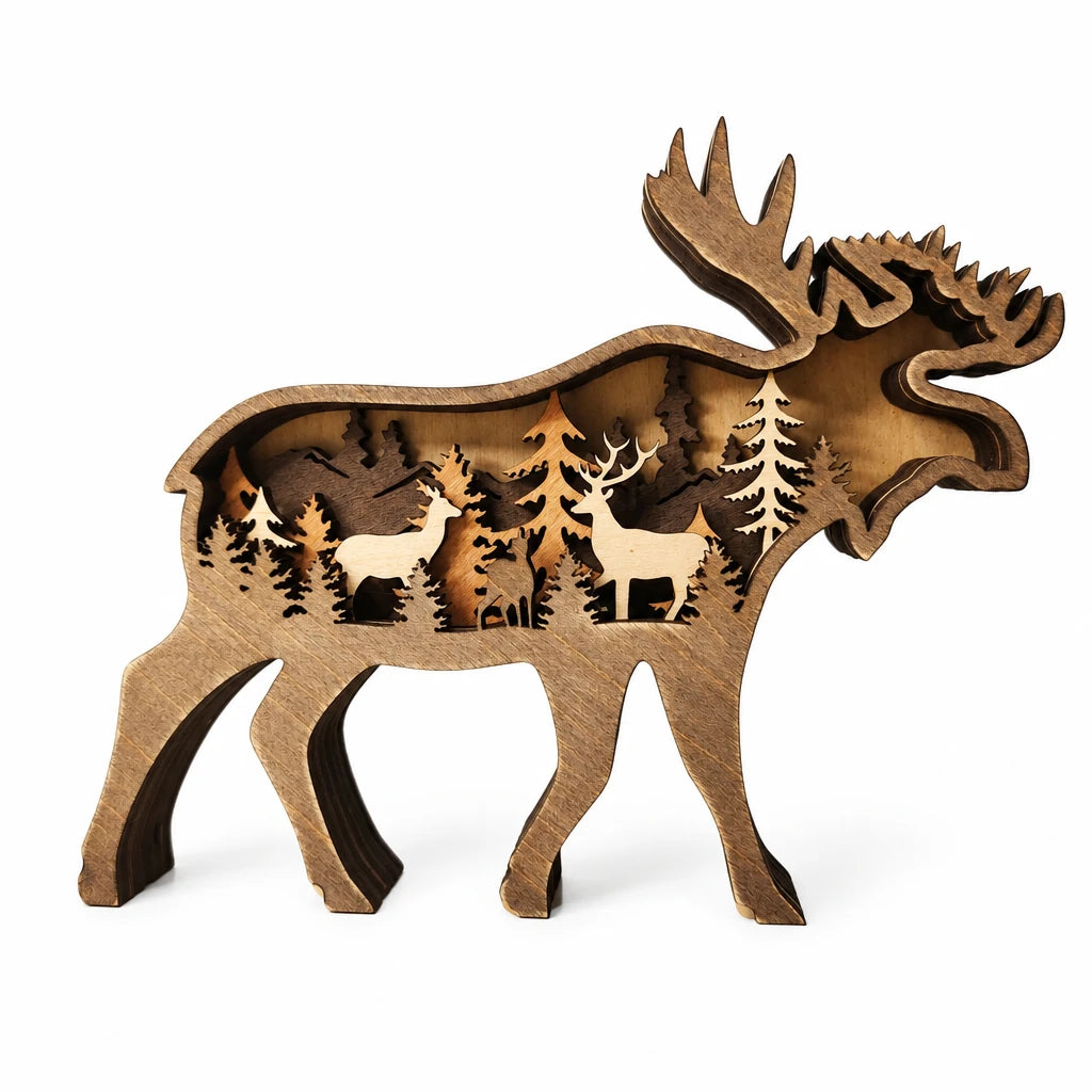 Wooden moose sculpture with cut-out designs of deer and trees on a white background