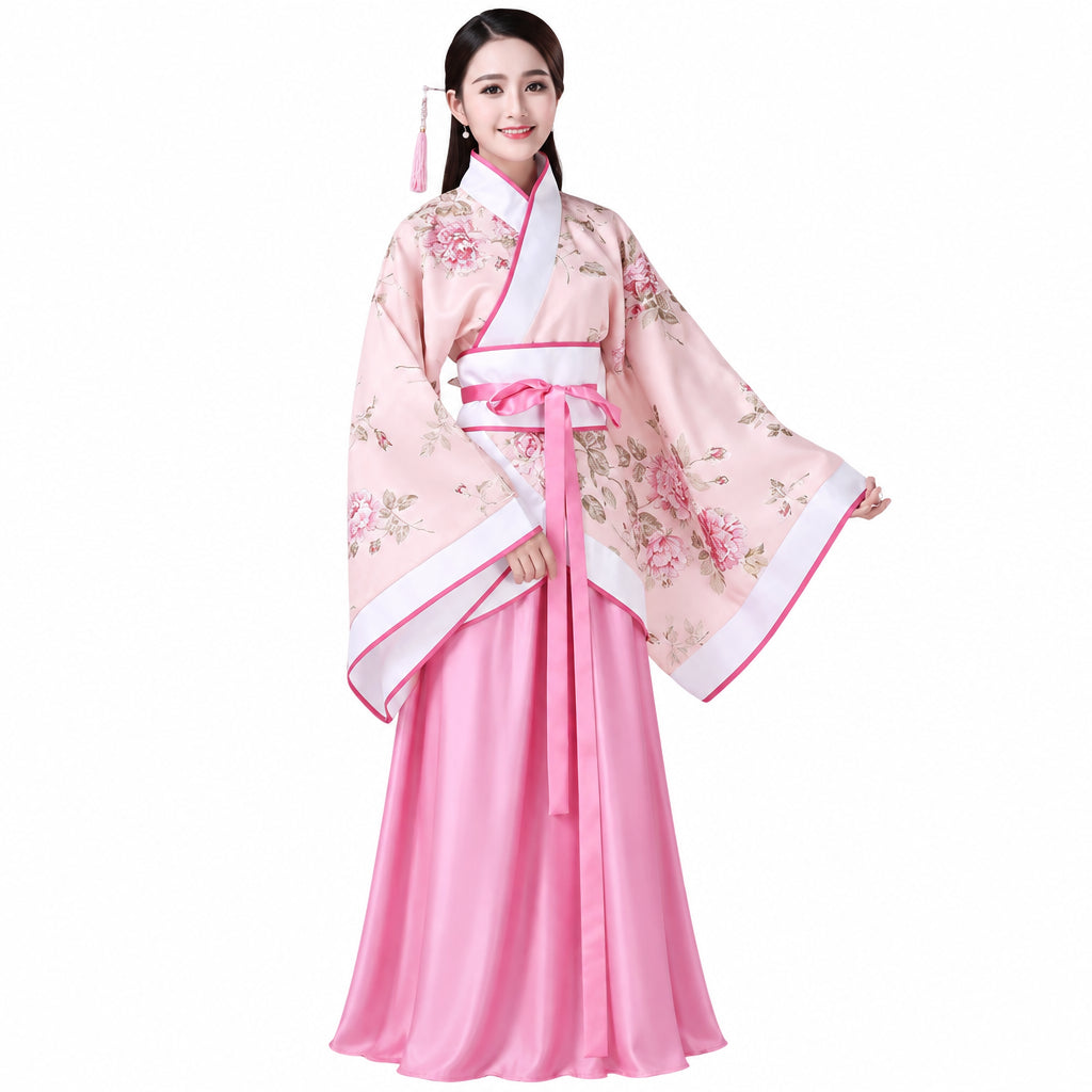 Woman wearing a traditional pink and white garment with floral patterns on a white background