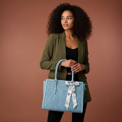 Woman carrying MOSISO floral laptop tote bag in blue