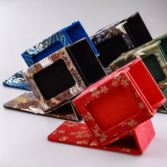 assorted trading card storage boxes in different colours