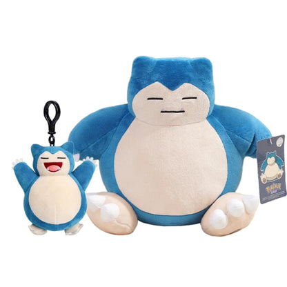Plush toy and keychain of a blue and white character on a yellow background