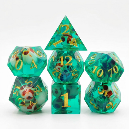 Seven translucent green resin polyhedral dice with embedded skull details and numbered faces